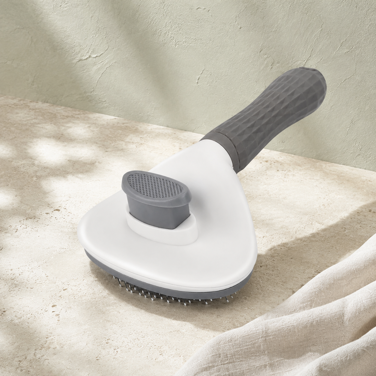 Brosse auto-nettoyante anti-poils pour chat et chien
